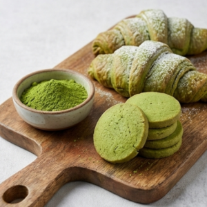 Classic culinary grade matcha powder displayed with baked matcha croissants and cookies, showing excellent color retention.