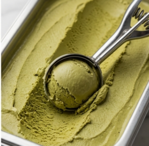 Scoop of matcha ice cream showing the thick consistency and color achievable with industrial grade matcha.
