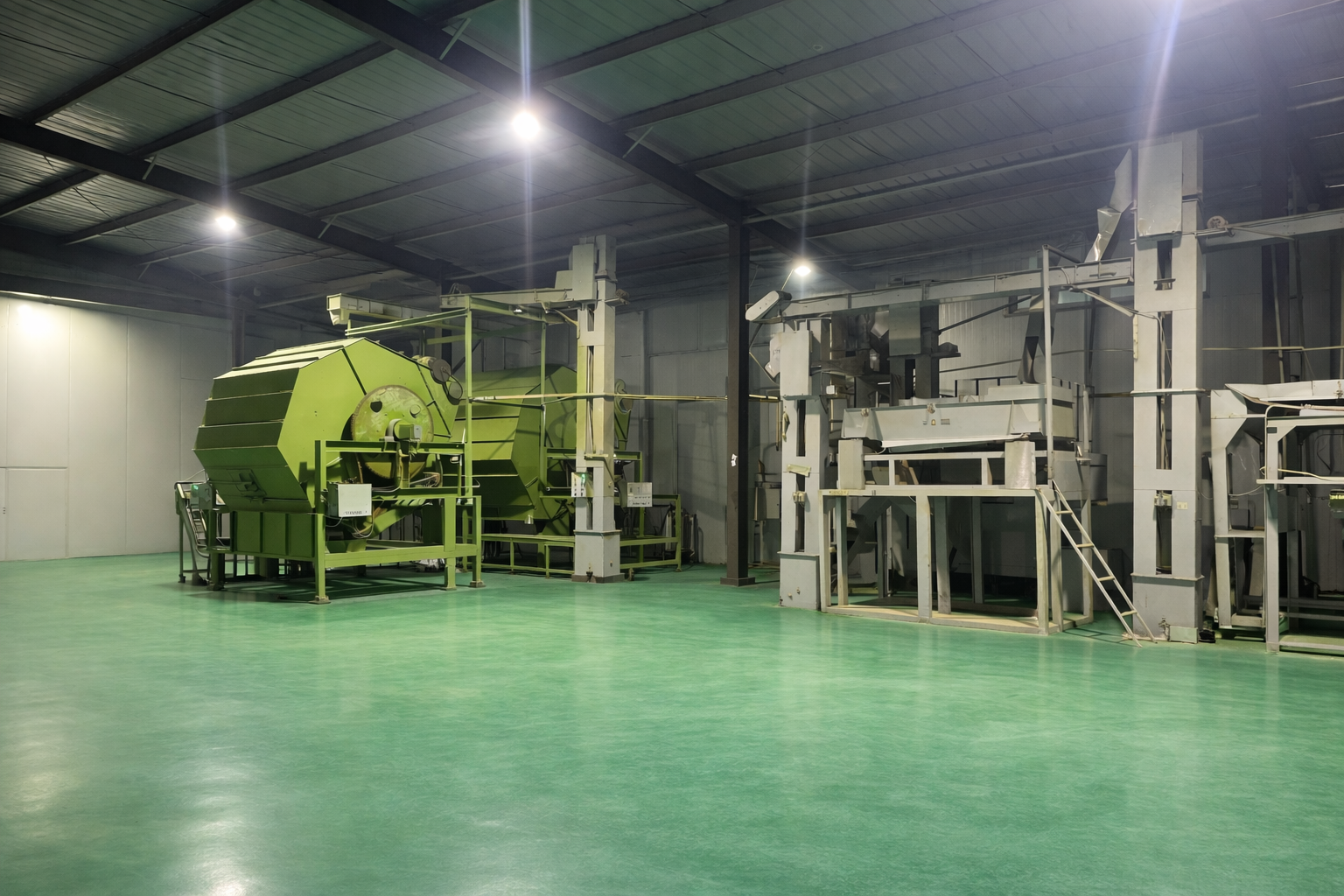 Interior of a modern, clean matcha processing facility with stainless steel equipment