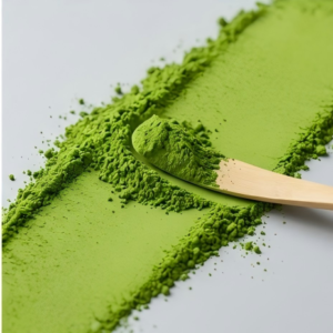 Finely ground premium matcha powder texture spread on a surface to show high quality and lack of clumps.